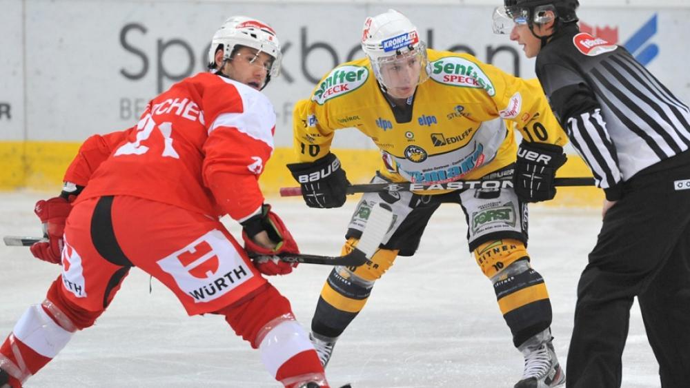 Mark McCutcheon and Joe Jensen face off at the faceoff point on Thursday.