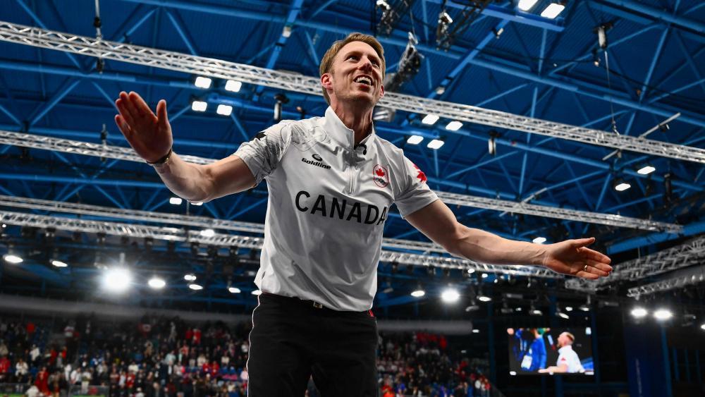 Marc Kennedy ist mit Kanada Olympiasieger. © APA/afp / MARCO BERTORELLO