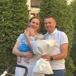 Once a biathlon heroine, now a proud mother.