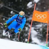 Dominik Paris mit goldenem Olympia-Helm in Bormio. © APA/afp / DIMITAR DILKOFF