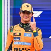 Lando Norris freut sich über die Pole Position. © APA/afp / JOHN THYS