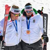 Giovanni Franzoni und Dominik Paris bei den Olympischen Spielen 2026. © APA/afp / FABRICE COFFRINI