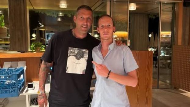 Prominent visit: Marco Materazzi (left) with fan Nicolas Oberbacher at Lake Kaltern.