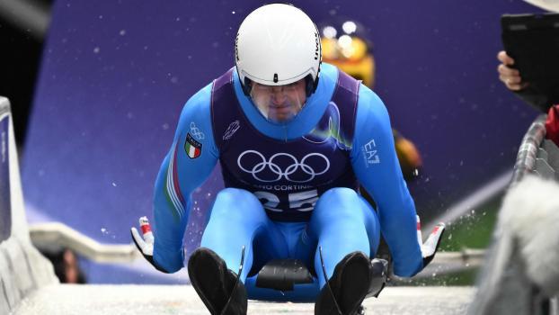 Dominik Fischnaller beim Training in Cortina. © APA/afp / MARCO BERTORELLO