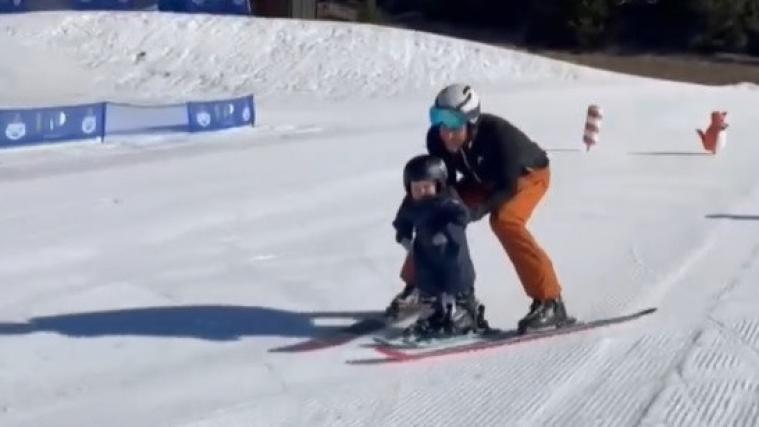 A little skier is out and about with his famous dad.