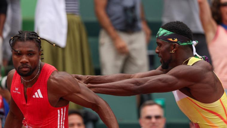 Noah Lyles (links) und Kenny Bednarek geraten im Ziel aneinander. © APA / PATRICK SMITH