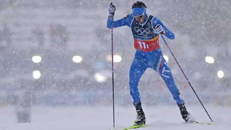 Aaron Kostner im Schneetreiben von Tesero. © APA/afp / JAVIER SORIANO