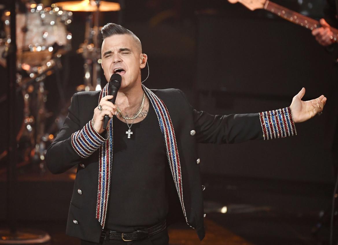 Robbie Williams wird ebenfalls auftreten. © APA/afp / JENS MEYER